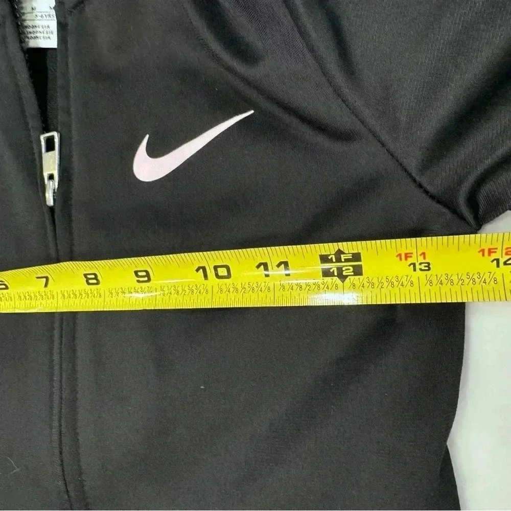 Nike Zip Up Jacket Girls Black and pink Swoosh Ruffle Hem Size 6 (5-6 Yrs)